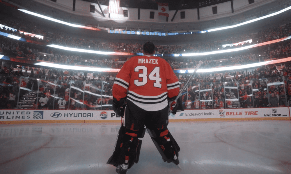 Petr Mrazek #34 of the Chicago Blackhawks takes in the National Anthem at the United Center